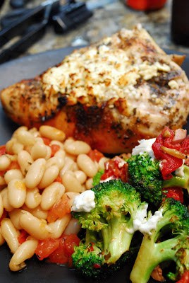 Baked Feta Chicken with Broccoli Red Pepper and Goat Cheese on a plate