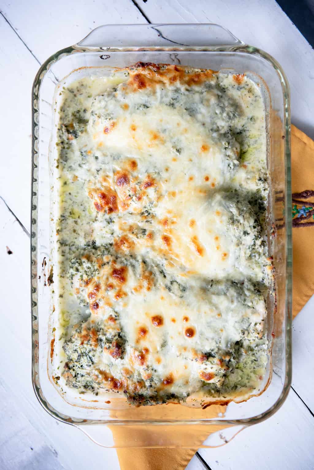 Keto Spinach Artichoke Chicken in a casserole dish